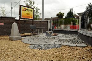 Grey paving slabs outside Finbarr O'Neills Ltd